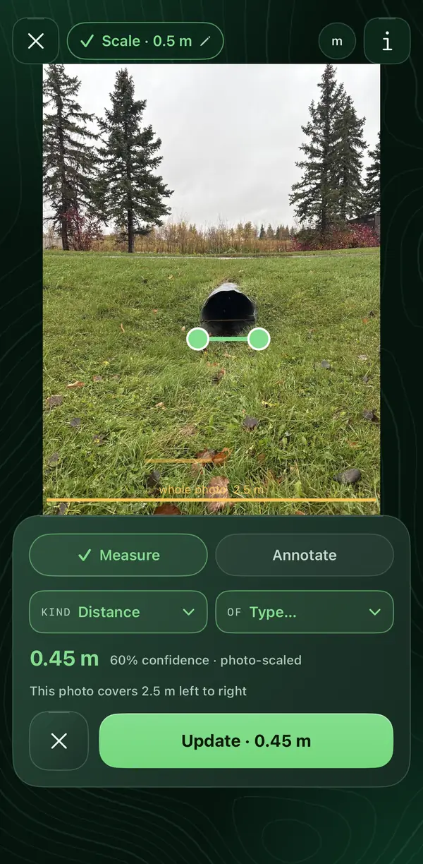 A photo of a culvert in a park lawn in the Siteseen app, with a line drawn across its opening, 0.45 metres, and the confidence in that measurement shown.